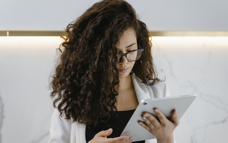 Woman searching on her tablet which form of therapy is most effective in treating depression. This represents how finding the right treatment and the right therapist for you is essential to the effectiveness.of your therapeutic process.