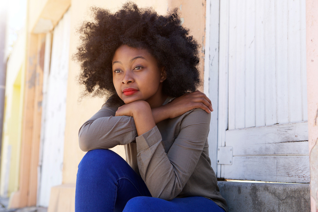 African american woman sitting hugging her knees ourside | therapy for sexual assault survivors | rape counseling | Baltimore, MD" width="314" height="209"