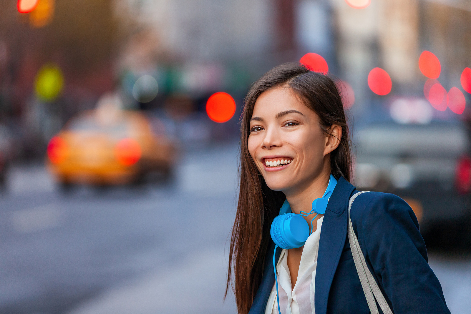 Young professional Asian woman wearing headphones in the city of Baltimore, MD | Treatment for Sexual Assault | Therapy for Sexual Assault | Counseling | Mental health help 21210" width="300" height="200"