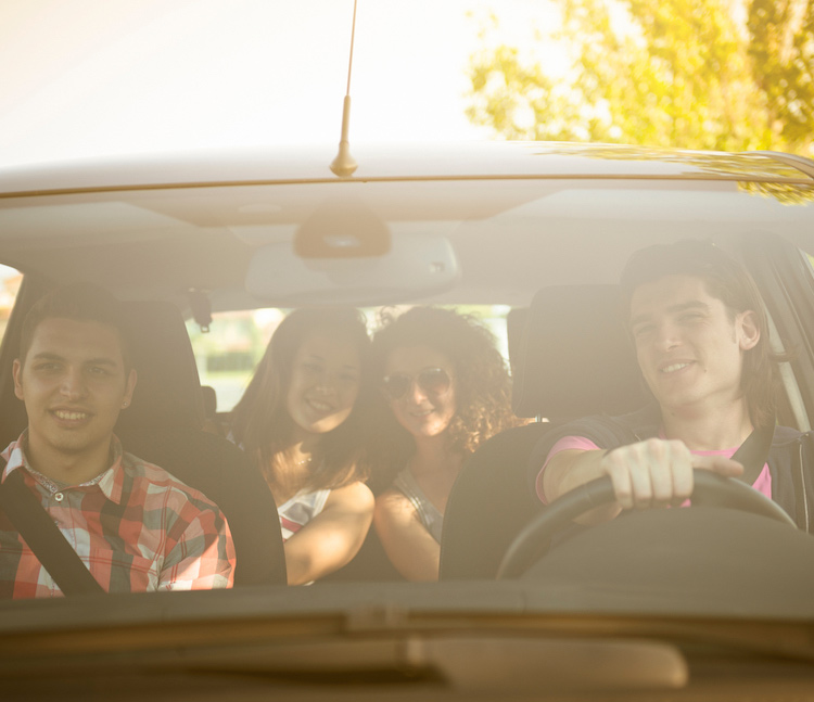 Happy friends inside a car after learning tools to strengthen their relationships during individual relationship counseling in Baltimore, MD 21210 at New Connections Counseling Center