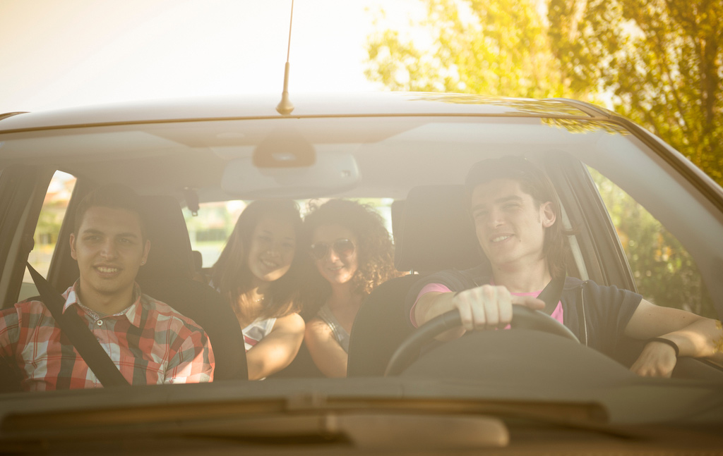 Happy friends inside a car after learning tools to strengthen their relationships during individual relationship counseling in Baltimore, MD 21210 at New Connections Counseling Center