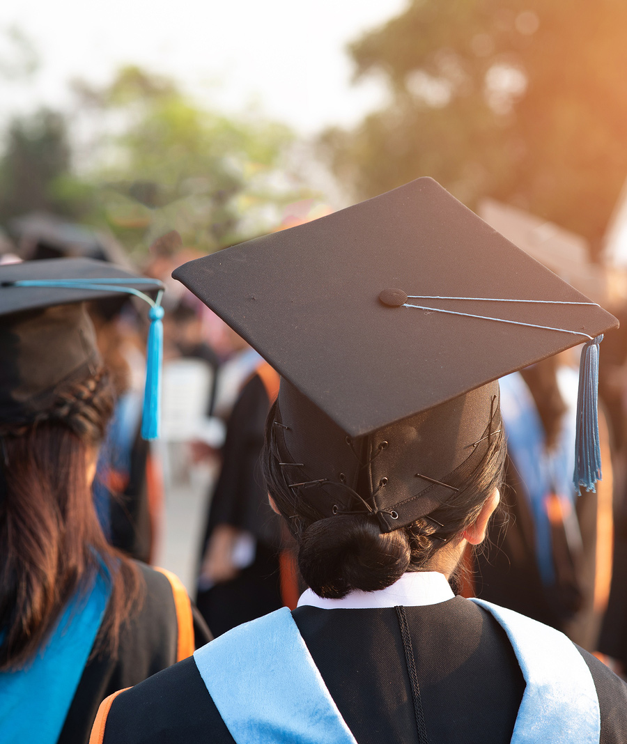 photo of the back of college graduates during graduation ceremony representing the life transition that graduation brings. Begin Counseling for life transitions in Baltimore, MD 21210 at the New Connections Counseling Center" width="300" height="200"