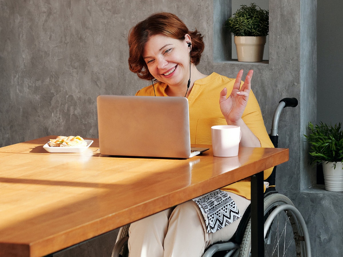 Photo of a woman in a wheelchair having a online therapy session in Maryland. This represents how online counseling is a convenient and accessible alternative to traditional in-person therapy, especially for those with mobility issues.