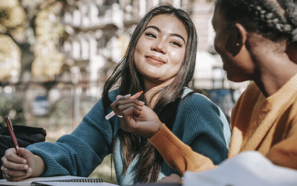 Student studying with a friend at college. This represents how parents' support of their college students' success is crucial for a positive college experience.