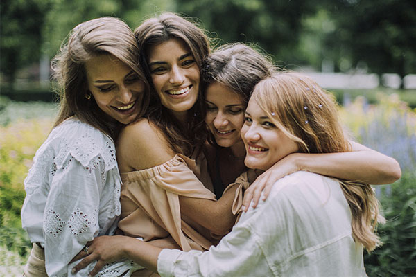 Group of friends hugging, representing how starting relationship counseling in Baltimore, MD helps you cultivate happier and healthier connections.<br />
